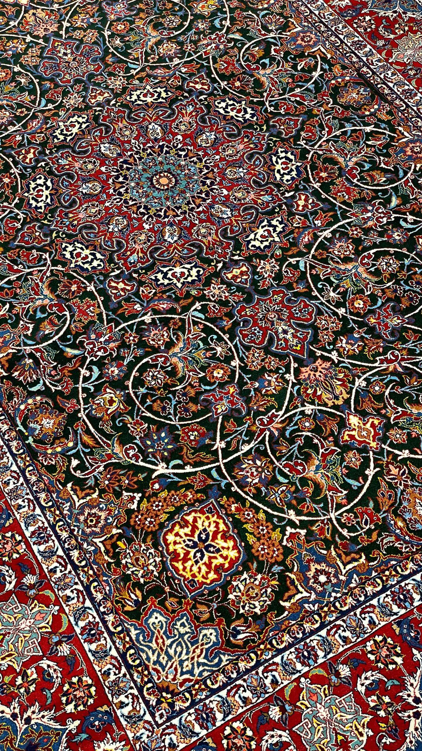 "Detailed corner view of the Seirafian carpet with traditional floral motifs."